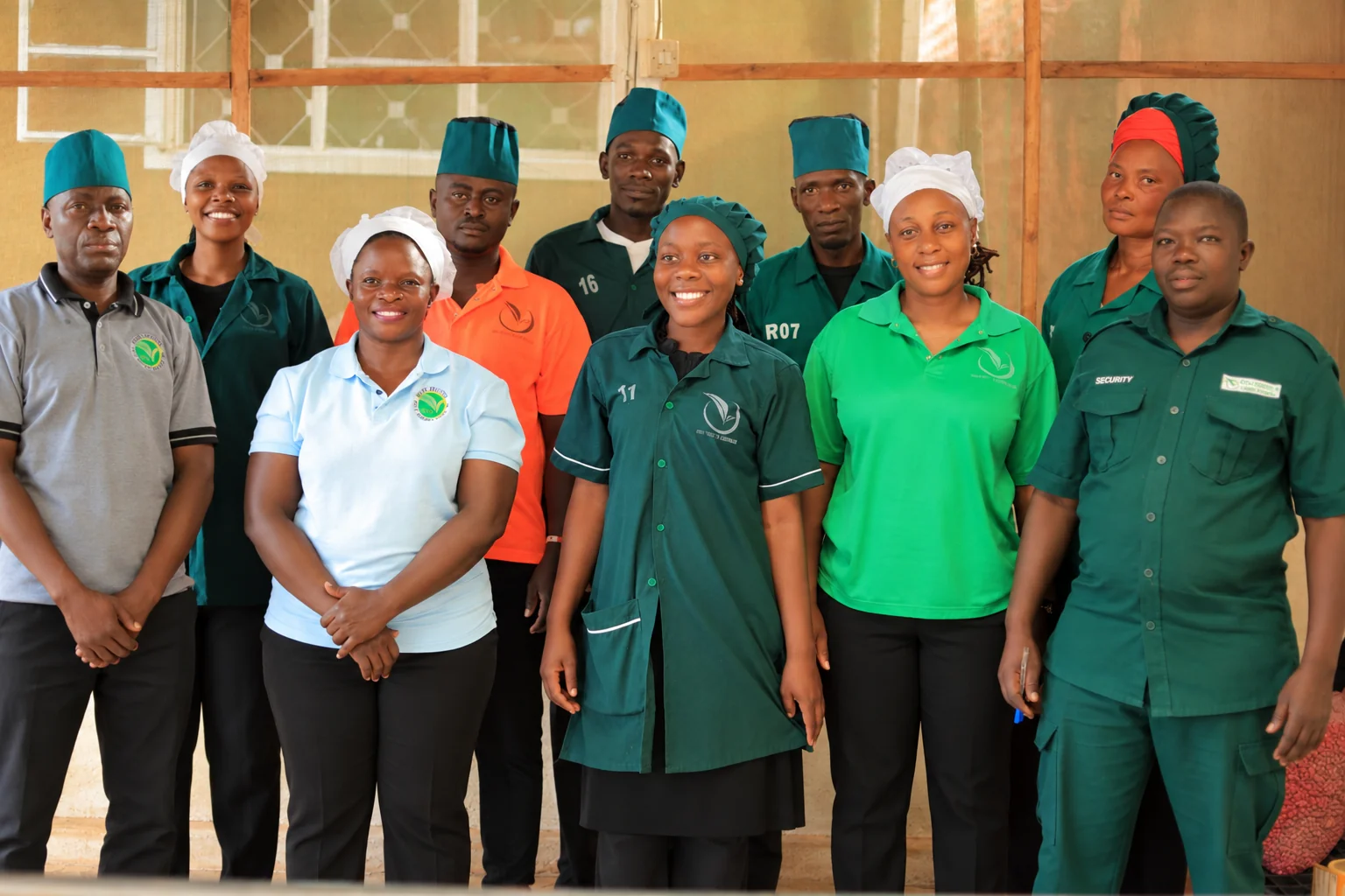 The Roki Fruits and Vegetables team standing together at the Najjanankumbi packhouse