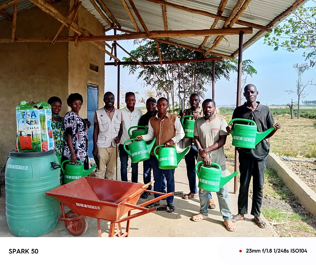 Roki Fruits Uganda field team and agricultural production equipment in Isingiro